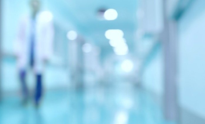 Explosion lawyer- Medical and hospital corridor defocused background with modern laboratory (clinic)